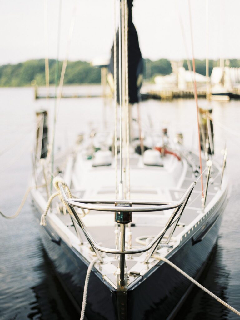 Close up on the bow of a sail boat on the water