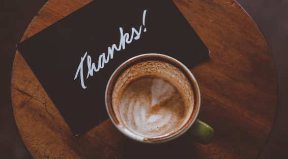 Aerial view of a latte and a card with 