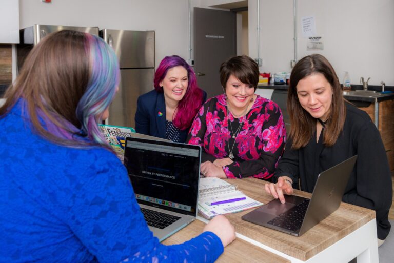 marketing team working on their pinterest strategy at a desk