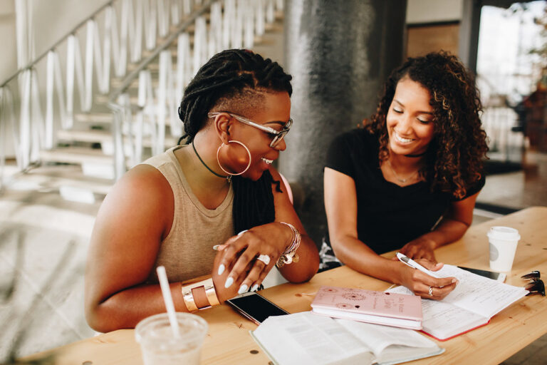 two women working on their passion project