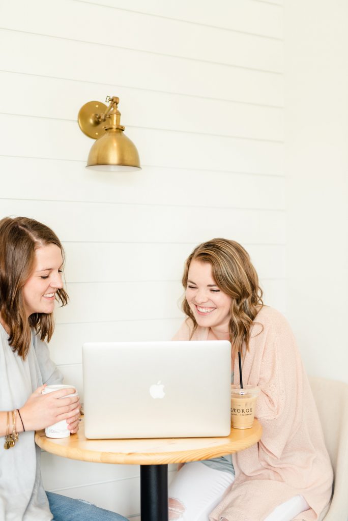 two women looking at a laptop and learning how to craft an evergreen sequence