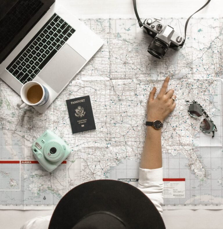 woman looking at a map learning how to manage her time while traveling