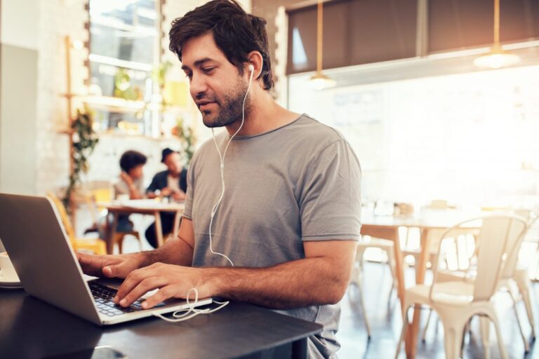 man on a laptop learning how to get more consulting clients fast