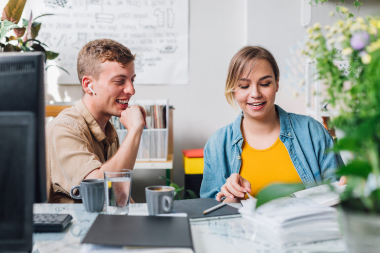 man and woman in an office learning how to convert more clients