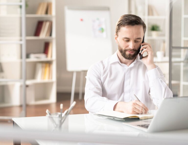 Man asking client onboarding questions on the phone