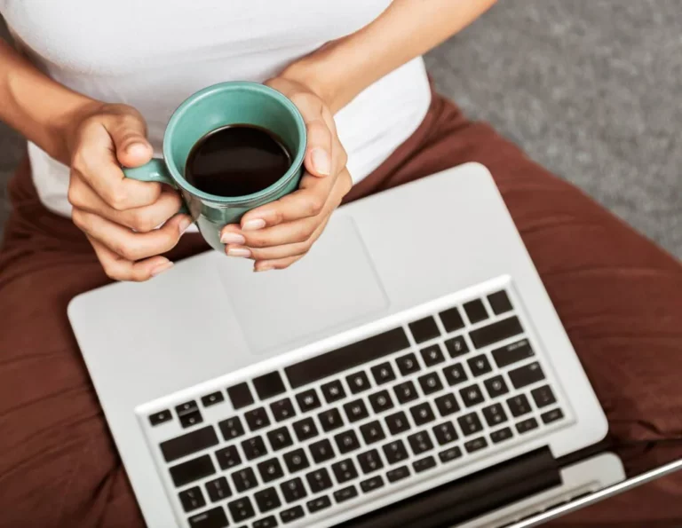 Person on laptop looking at HoneyBook plans