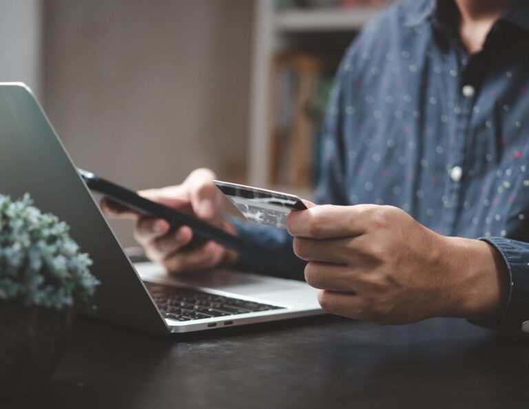 Man using an online payment portal to pay with credit card