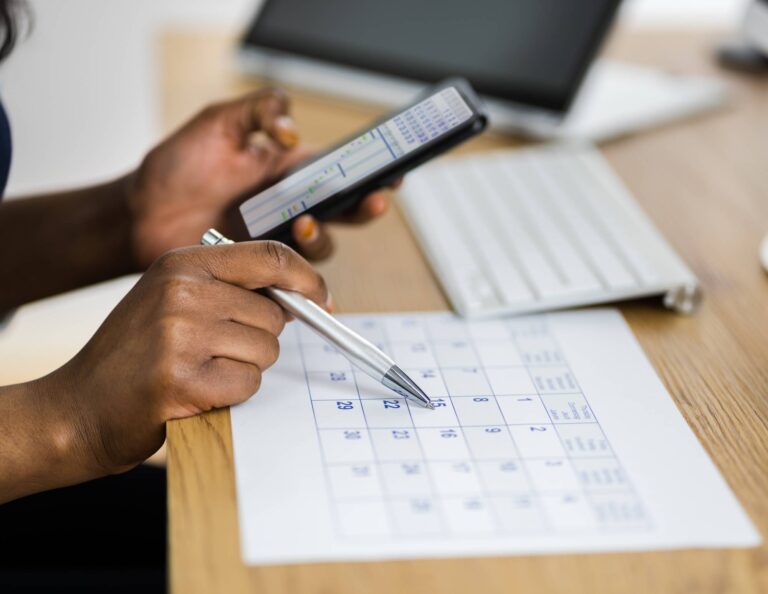 Person working on writing down a round-robin scheduling process