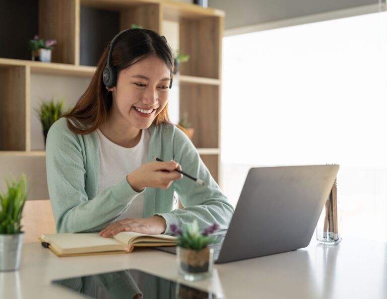 Freelancer invoicing on her laptop